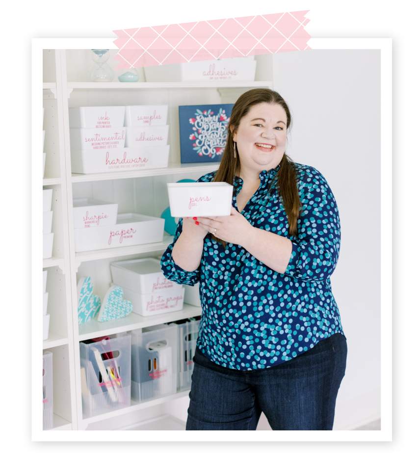 Laura holding an organizing bin