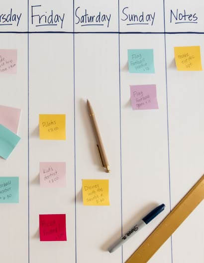 A DIY calendar using posterboard and sticky notes