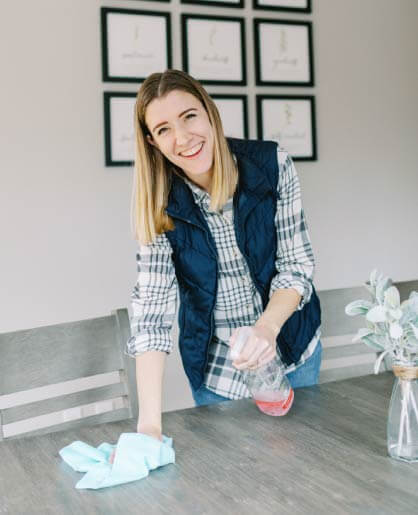 Tasha cleaning her kitchen table