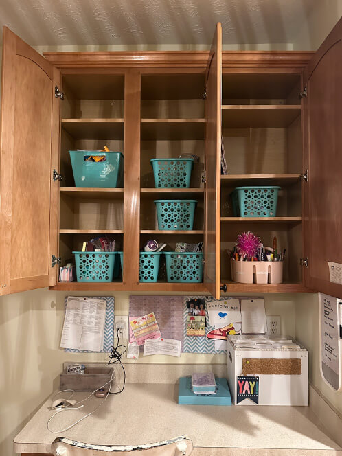 An organized craft cabinet with a clean desk and new empty space