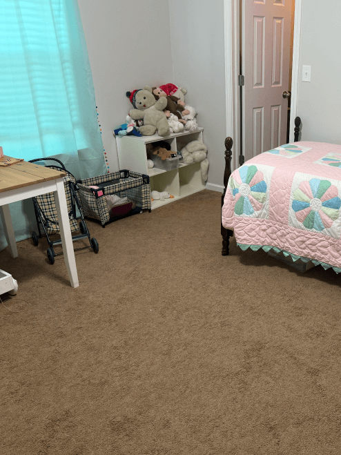 A clean kid's room with toys put up