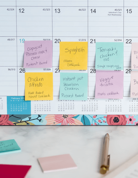 Sticky notes on a large wall calendar